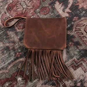 Handmade leather fringe clutch